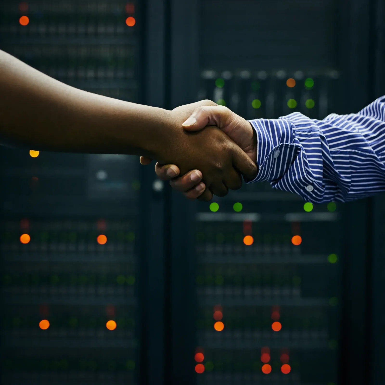 Handshake in front of web hosting servers in a data centre